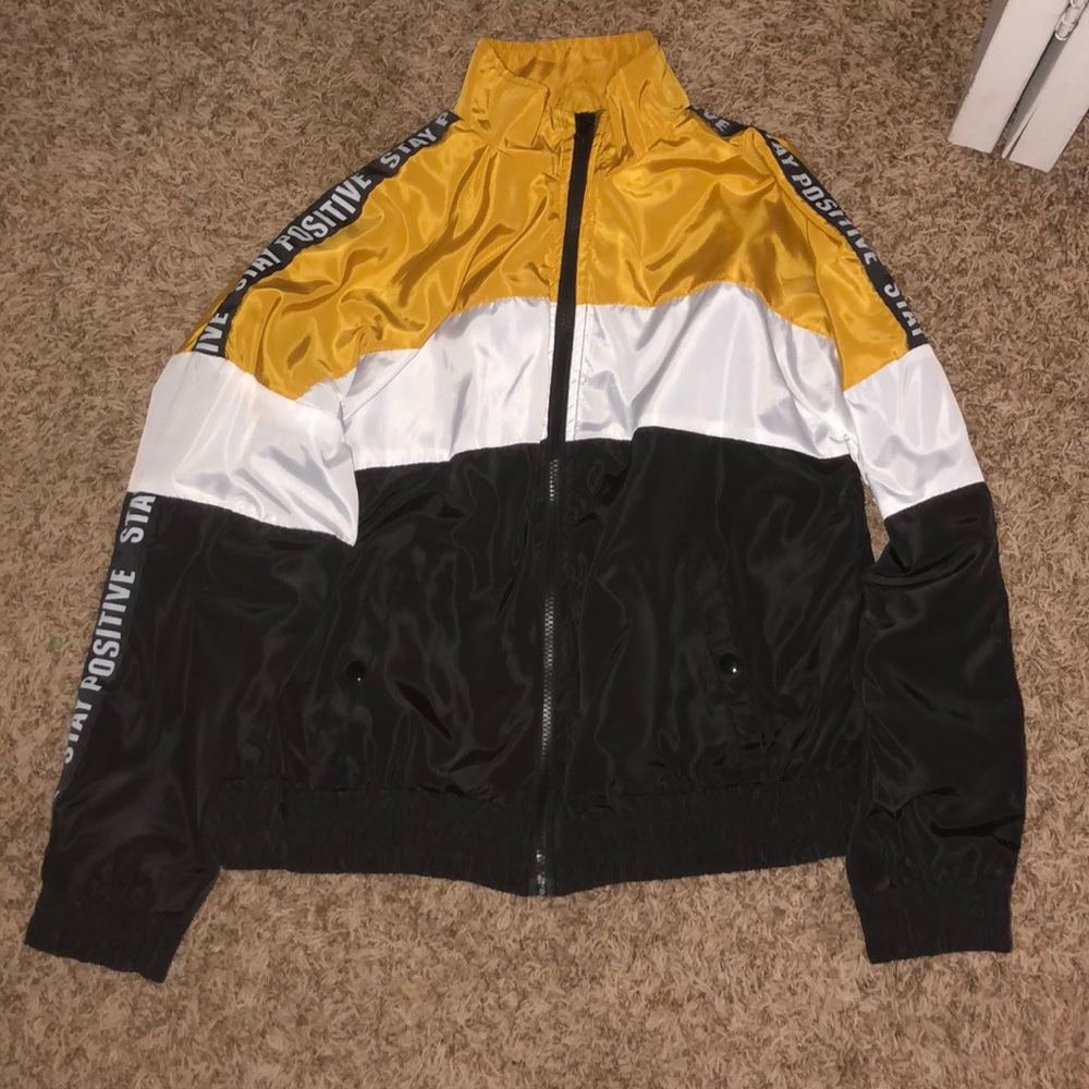 Large Black, White and Yellow Wind Breaker